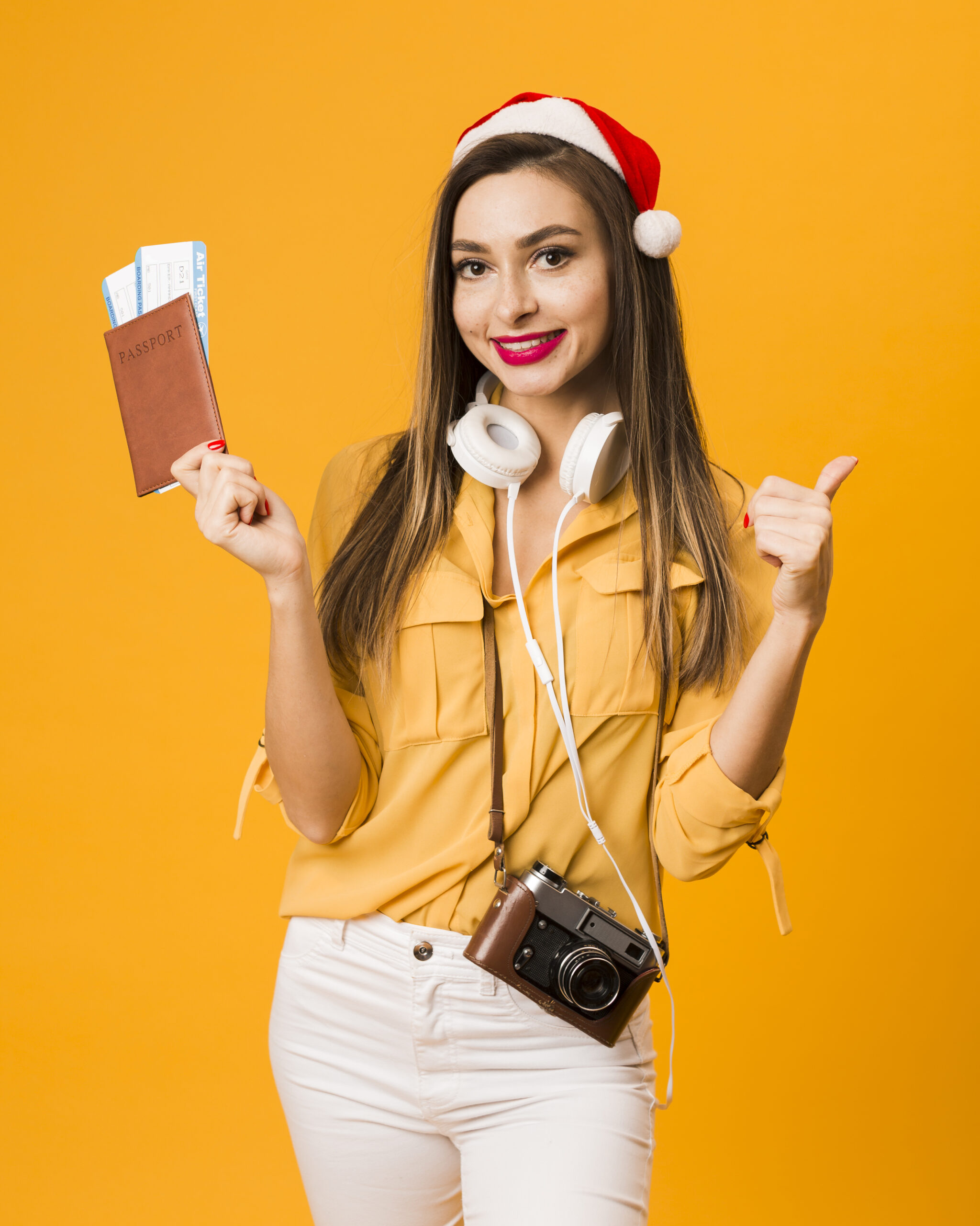 front-view-woman-holding-passport-with-plane-tickets-giving-thumbs-up